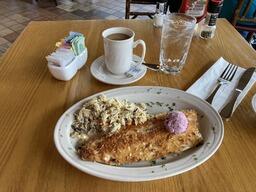 Pecan crusted mountain trout with blueberry butter and rice pilaf