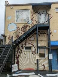 Nature Mural Painted Around a Staircase on a Rear Wall of Charleston Yoga Massage