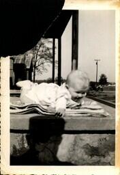 Baby on the porch of the little White House