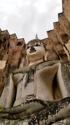 Pra Ajana is a large buddha statue located in Wat Sri Chum temple, Sukhothai Historical Park, Thailand.