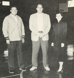 Fred McCall, pictured with unknown man and woman, was the head basketball coach for Campbell College and founded the basketball camp. McCall invented the "McCall Rebounder," a widely used technique to teach proper rebounding and is in the North Carolina Sports Hall of Fame.