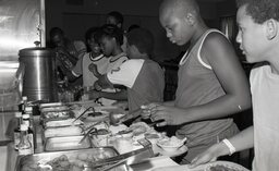 Dinner is served to Campbell University Basketball Camp attendees. This is one of few photos that features boys and girls together.