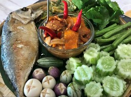 Nam Prik or chili dip is normally served with fresh vegetables.  There are many kinds of Nam Prik in Thai cuisine.  This one, in particular, is Nam Prik Kapi (Shrimp paste chili dip) which is generally served with fried mackerel fish along with fresh vegetables. 