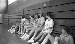 Girl campers take a break on the bleachers at Campbell's basketball camp in 1982.