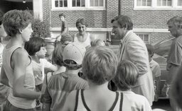 Beloved UNC head basketball coach Dean Smith is greeted eagerly by Campbell basketball campers.