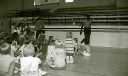 Campers applaud for basketball legend Michael Jordan who joined the coaching staff at Campbell's basketball camp.