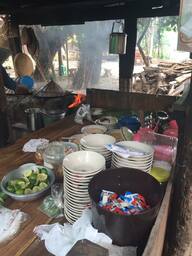 An original open-air noodle restaurant with a wood frame stove.  Sukhothai, Thailand.