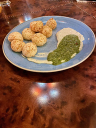 Cheese bread balls served with chimichurri cream cheese