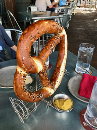 A Giant Pretzel with Spicy German Mustard and Beer-Cheese Fondue