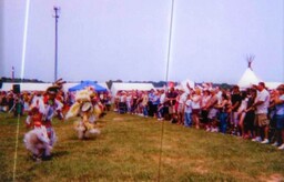 Grass Dancers performing at pow-wow-Grass Dancers are identified by the long tassels on the ends of their clothing as well as the nature of their headdresses.