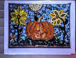 Halloween Decor made from stained glass, grout and an old window.