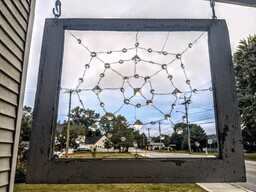 Cobweb decoration made from wire, crystals and an old window. 