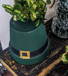 Terracotta pot turned upside down and painted to look like a leprechaun's hat.