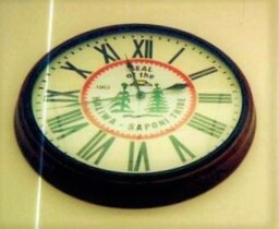 A photo of a clock featuring the seal of the Haliwa Saponi tribe.