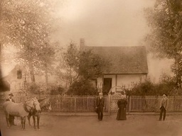 This is the original photograph of My great-grandfather, Wallace McLean, his parents, John and Martha McLean, and Ernie Campbell, who worked for them on the farm. We believe this photograph was taken around 1895 due to the age of my great-grandfather and the location of the house, which was moved for the current farmhouse to be built in 1903.  A heavily colorized version of this photograph serves as the thumbnail for this collection.