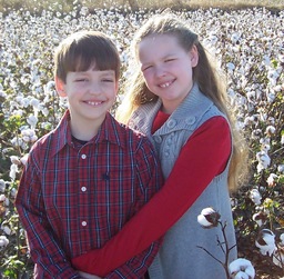 My Children, posing in a field of cotton that is ready to be picked.  