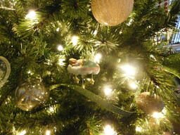 Ornament designed as a small infant sleeping on a cloud. The first Christmas ornament of a young boy