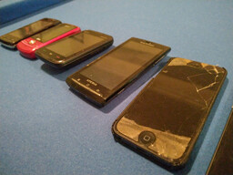 A line up of on person's various cellphone models as they replaced them over the years.