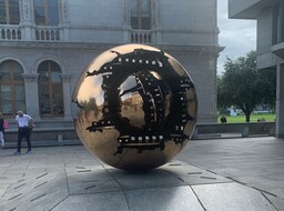 Bronze sculpture created in 1982 by Arnoldo Pomodoro situated outside the Berkeley Library at Trinity College in Dublin.