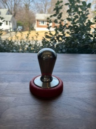 A tamper is used to press down coffee grounds inside a portafilter. This allows for a more even extraction.