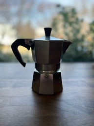 A moka pot is an Italian method of brewing. There is a filter inside the bottom half where the grounds are placed. Water is put in the bottom half and is boiled up through a tube in the middle. The coffee is emptied into the top half of the pot.