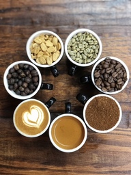 This picture shows coffee in its various stages, from the coffee cherry to the finished drink.