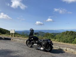 "A 'bald' refers to a mountain top that has an area with either no vegetation or some type of shrub or grass instead of tall trees... Since the Parkway’s creation, farming has ceased on most of the park land, allowing trees to reclaim the balds." Quoting Steven L. Markos, National Park Planner, https://npplan.com/parks-by-state/north-carolina-national-parks/blue-ridge-parkway-park-at-a-glance/blue-ridge-parkway-scenic-overlooks/blue-ridge-parkway-bunches-bald-overlook-mp-459-5/ 