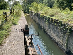 "The trail begins at the James River Visitor Center and gently slopes down to the foot bridge crossing the river before descending the 39 stairs to the south river bank. From there, the trail follows the bridge to the tow path/prism then downstream to Lock #7 with its corresponding waste weir and slackwater connection to the river." Quoting the NPS, https://www.nps.gov/places/canal-trail.htm 