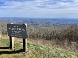 View Wilson Creek Valley Overlook is located at milepost 302.1 and sits at an elevation of 4,356 feet. 