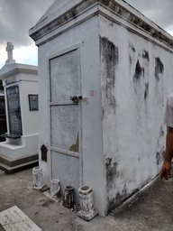 One of the notable tombs in the St Louis Cemetery #1, the tomb of the alleged voodoo priestess is common adorned with flowers, coin, alchohol, and other offerings.