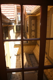 An atrium  on the roof near the middle of the house.