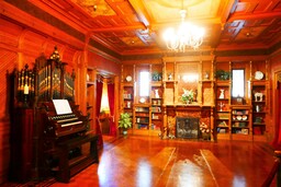 Local residents heard "ghostly music" coming from the house are explained by the fact that Winchester often played the pump organ in the Grand Ballroom when she was unable to sleep. Quoted from - https://en.wikipedia.org/wiki/Winchester_Mystery_House