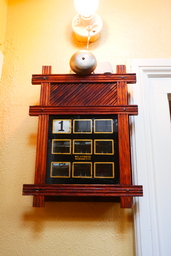 An annunciator, an early form of intercom, which was a common feature of large homes during this time period, was installed for calling servants. Quoted from -https://en.wikipedia.org/wiki/Winchester_Mystery_House