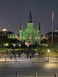 The front of the St Louis Cathedral at night.